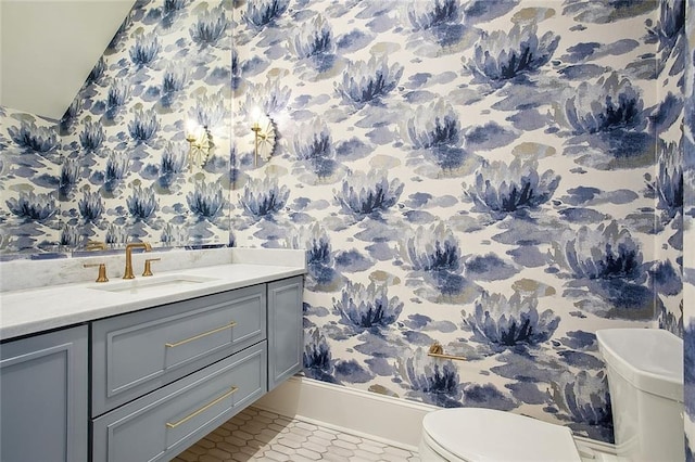 bathroom with tile patterned flooring, toilet, and sink