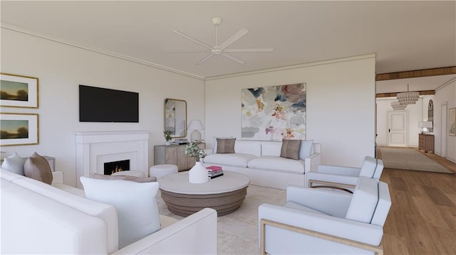 living room with light hardwood / wood-style flooring, ceiling fan, and crown molding