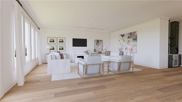 living room with wine cooler, ceiling fan, crown molding, and light hardwood / wood-style floors