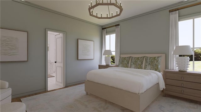 bedroom featuring ensuite bath, a chandelier, and ornamental molding