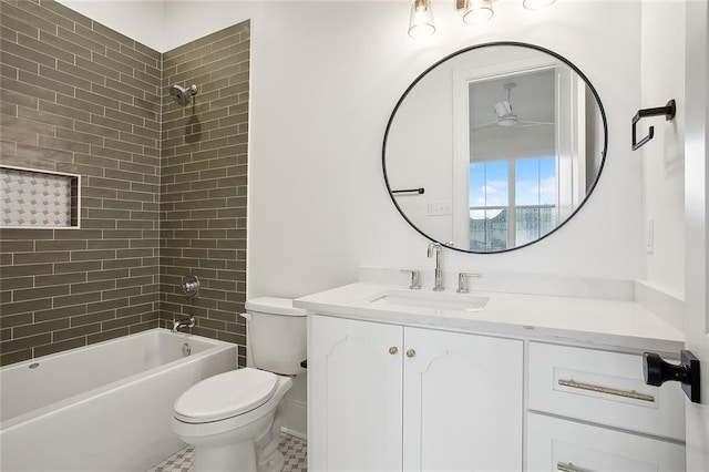 full bathroom featuring toilet, vanity, tiled shower / bath combo, and tile patterned flooring