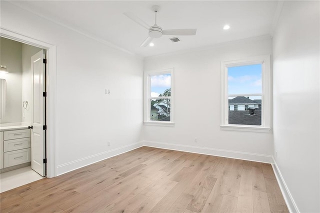 unfurnished room with light hardwood / wood-style flooring, ceiling fan, and ornamental molding