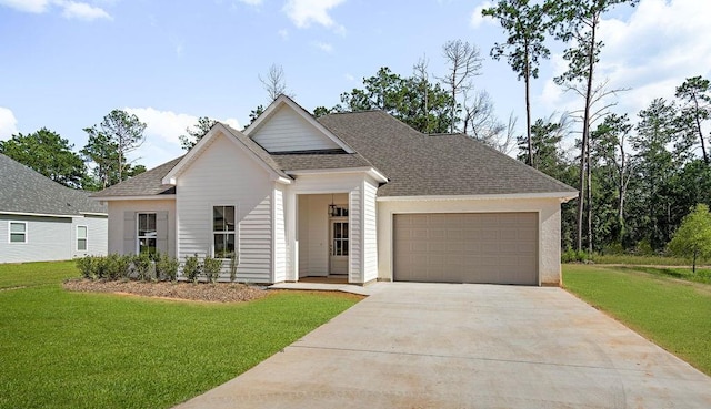 view of front of house featuring a garage and a front yard