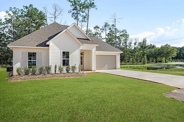 view of front facade featuring a front yard and a garage