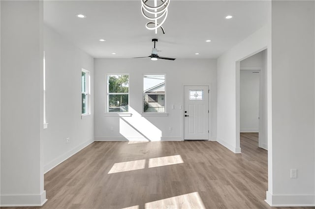 foyer featuring ceiling fan and light hardwood / wood-style floors