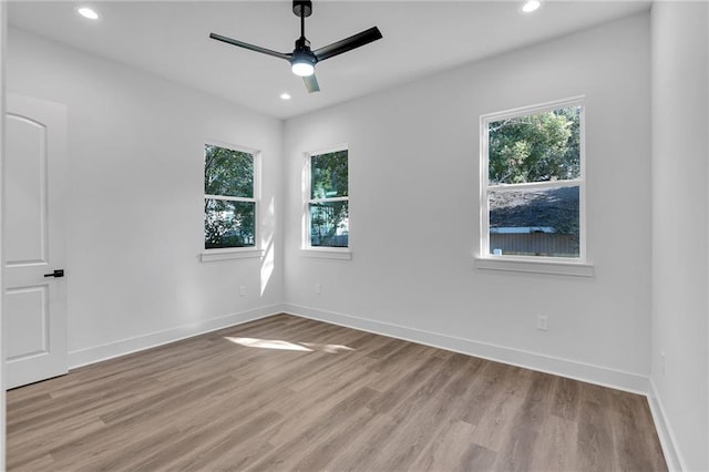 unfurnished room featuring ceiling fan and light wood-type flooring