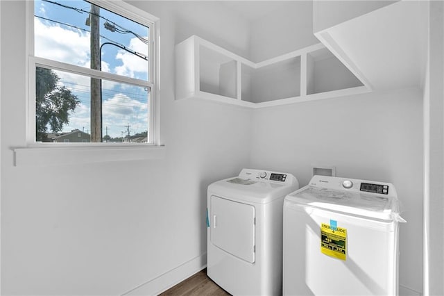 washroom featuring dark hardwood / wood-style floors and separate washer and dryer