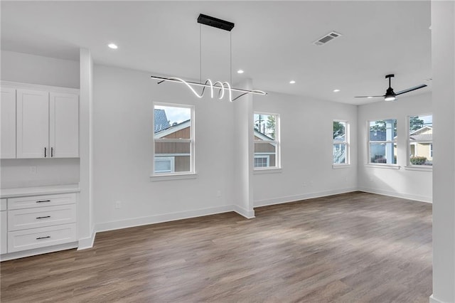 4313 Randolph Ave, New Orleans, LA 70122 - unfurnished dining area with wood finished floors, recessed lighting, baseboards, and a ceiling fan