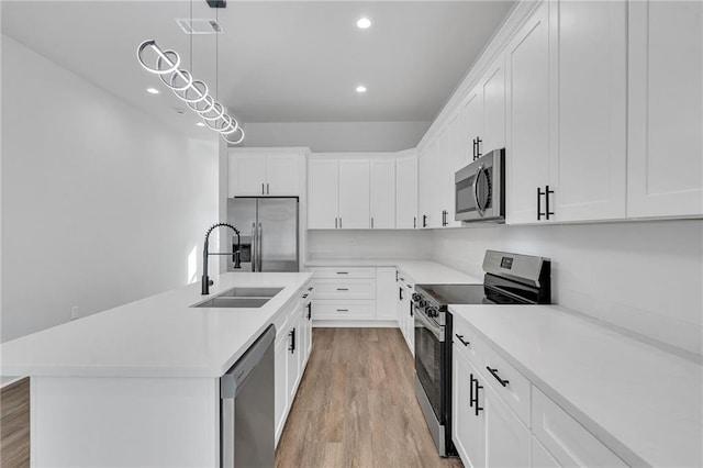 4313 Randolph Ave, New Orleans, LA 70122 - kitchen with stainless steel appliances, a sink, recessed lighting, light countertops, and white cabinets