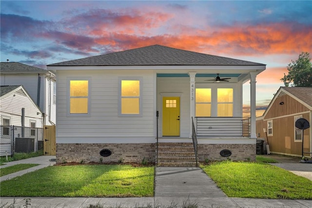 4313 Randolph Ave, New Orleans, LA 70122 - view of front facade featuring a porch, a front lawn, and a ceiling fan