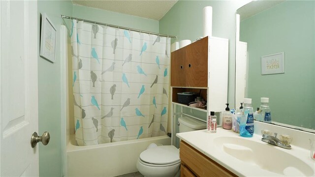 full bathroom with vanity, toilet, and shower / bath combo with shower curtain