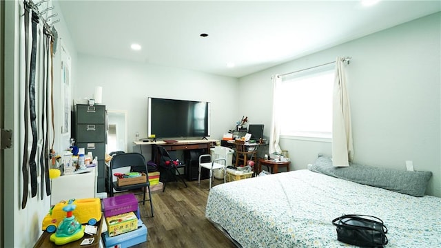 bedroom with dark wood-type flooring