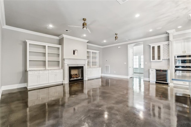 living room featuring ornamental molding, ceiling fan, and beverage cooler