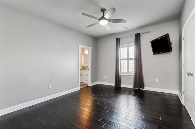 unfurnished room with ceiling fan and dark hardwood / wood-style floors