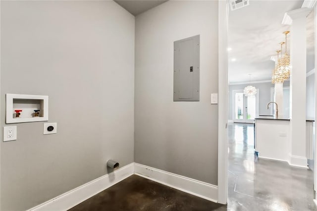 clothes washing area featuring washer hookup, hookup for an electric dryer, electric panel, a notable chandelier, and sink