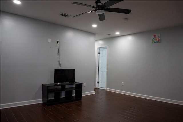 unfurnished living room with dark hardwood / wood-style floors and ceiling fan