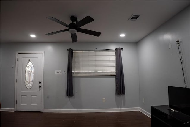 foyer with dark hardwood / wood-style floors and ceiling fan