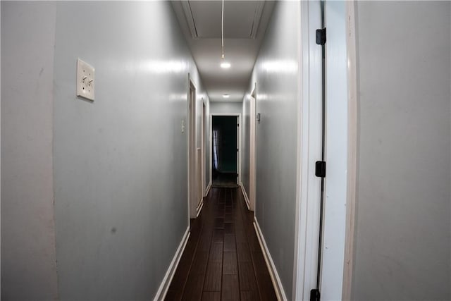 corridor featuring dark wood-type flooring