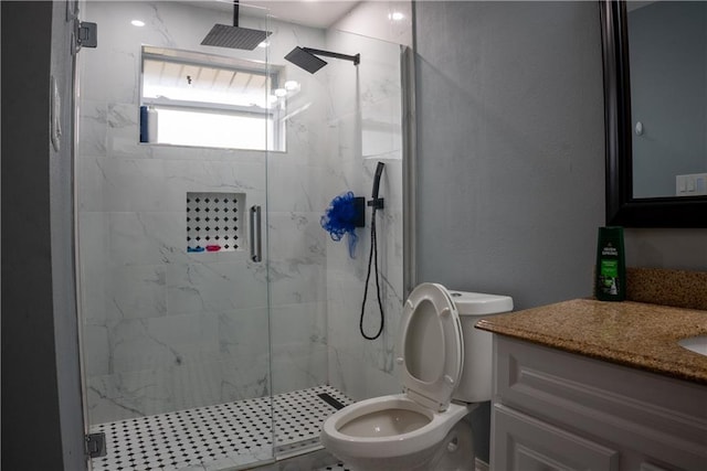 bathroom with vanity, toilet, and an enclosed shower