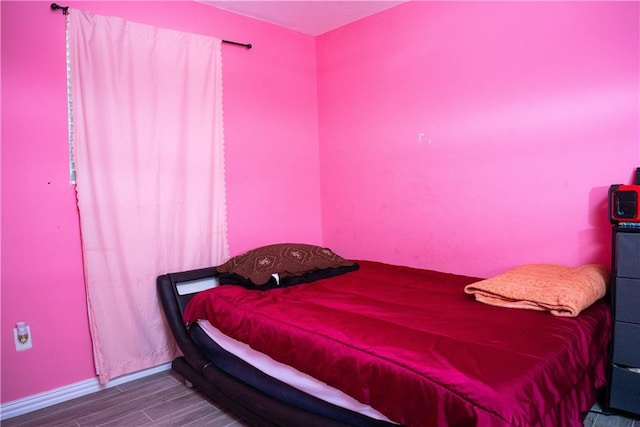 bedroom featuring hardwood / wood-style flooring