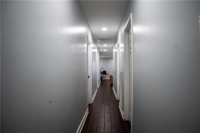 hall with dark hardwood / wood-style floors