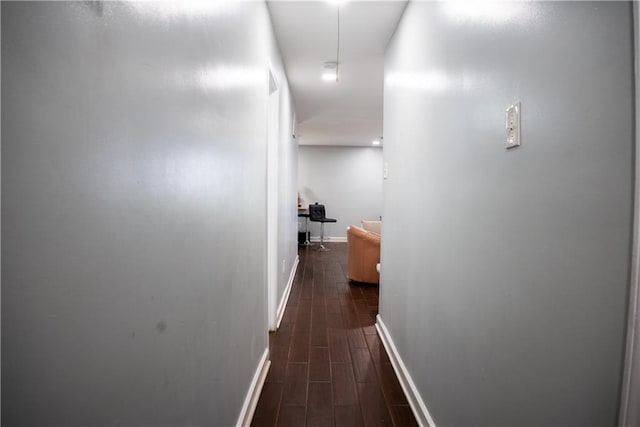 corridor featuring dark hardwood / wood-style flooring