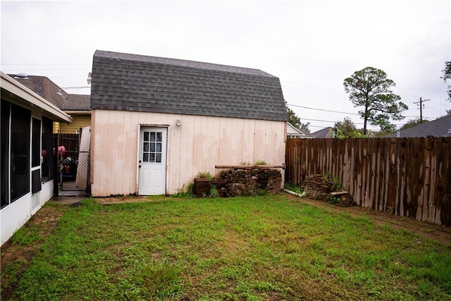 view of outdoor structure with a lawn