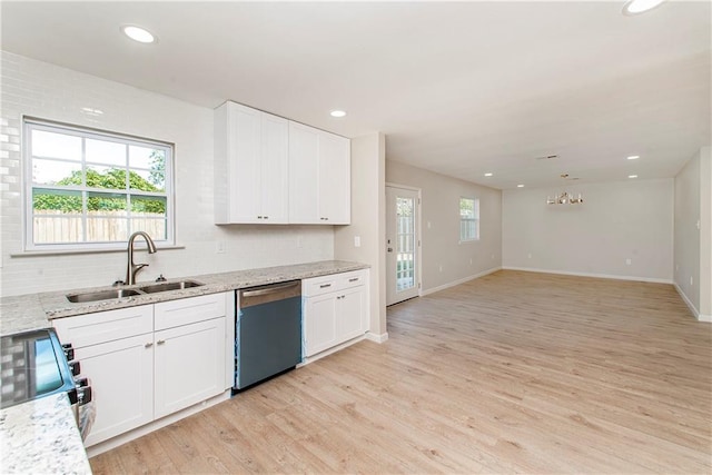 kitchen with dishwasher, light hardwood / wood-style floors, white cabinetry, and sink