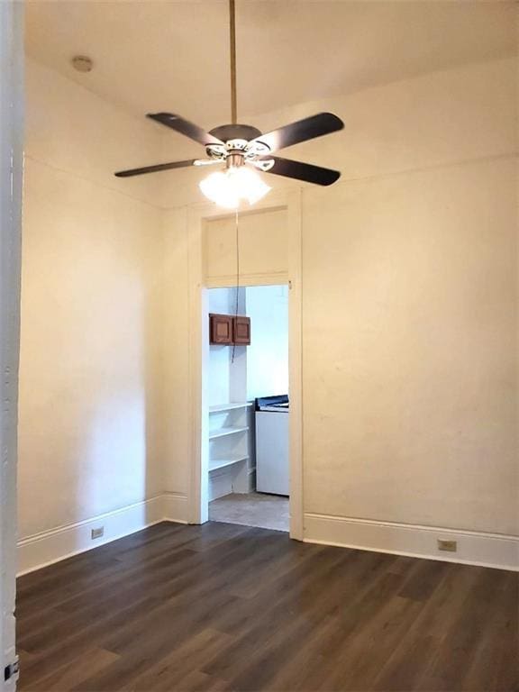 unfurnished room with ceiling fan and dark hardwood / wood-style floors