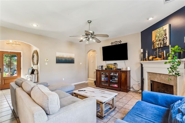 living room featuring ceiling fan and light tile patterned floors