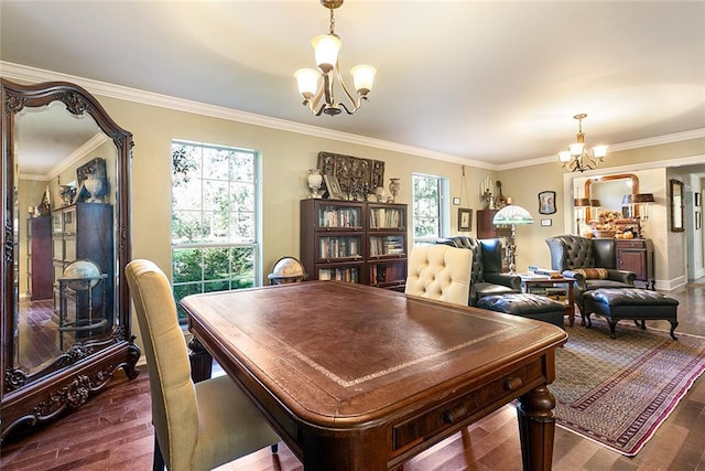 dining room featuring dark wood-type flooring, a wealth of natural light, crown molding, and an inviting chandelier