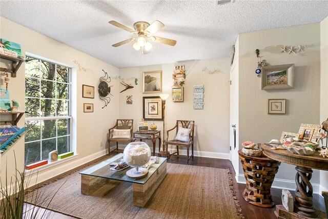 bedroom with ornamental molding, ceiling fan, and dark wood-type flooring