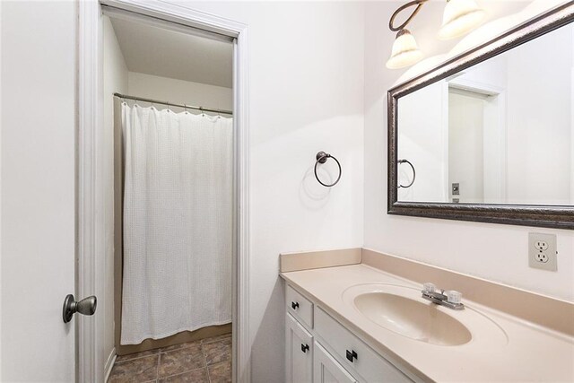 clothes washing area with washer and clothes dryer, light tile patterned flooring, and a textured ceiling