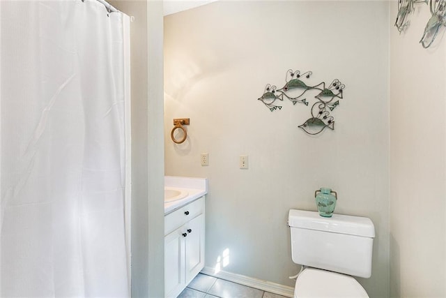 full bathroom with baseboards, toilet, tile patterned floors, curtained shower, and vanity