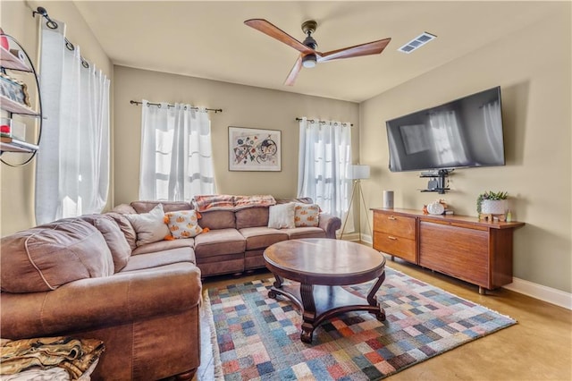 living room featuring ceiling fan