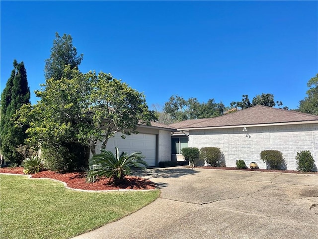 view of property exterior featuring a lawn and a garage