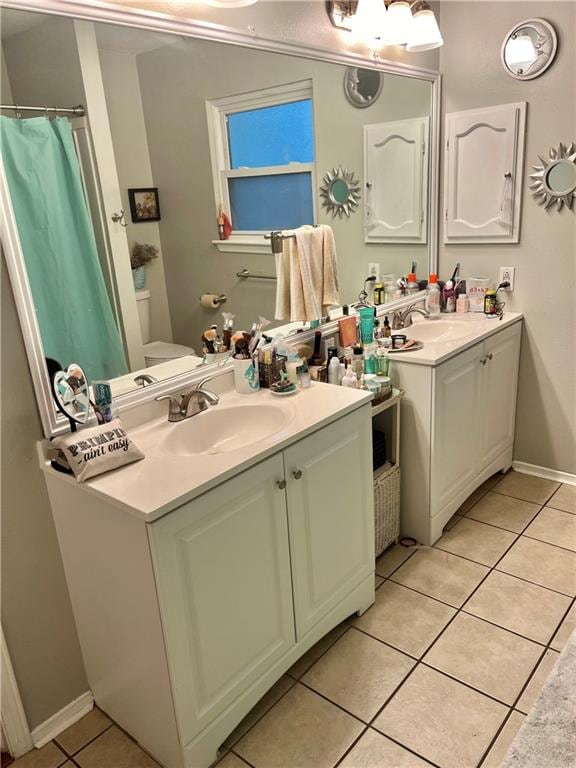 bathroom with vanity and tile patterned floors