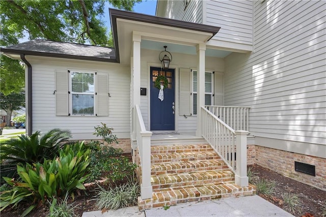 property entrance featuring a porch