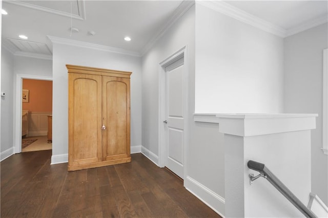 corridor featuring dark hardwood / wood-style floors and crown molding