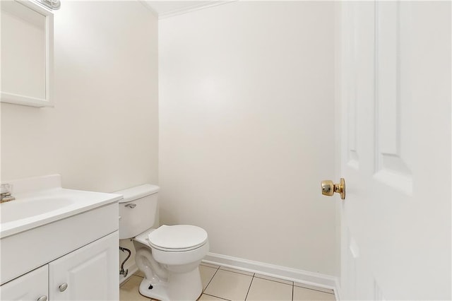 bathroom with tile patterned floors, vanity, and toilet