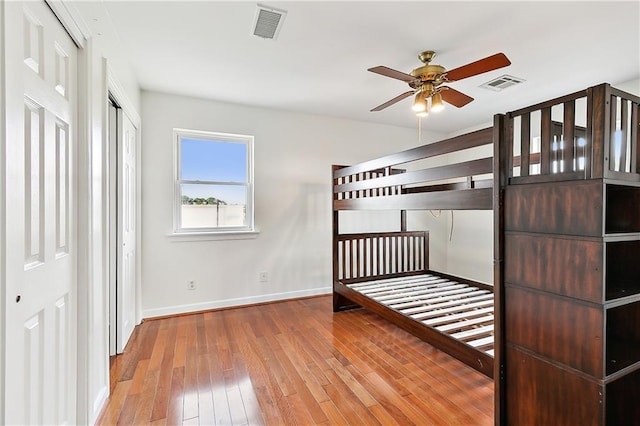 unfurnished bedroom featuring ceiling fan and light hardwood / wood-style floors