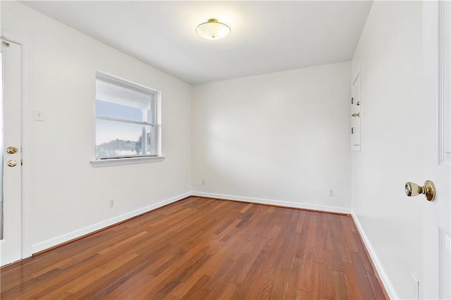 empty room featuring hardwood / wood-style flooring