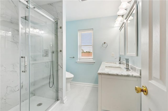 bathroom with vanity, toilet, and walk in shower