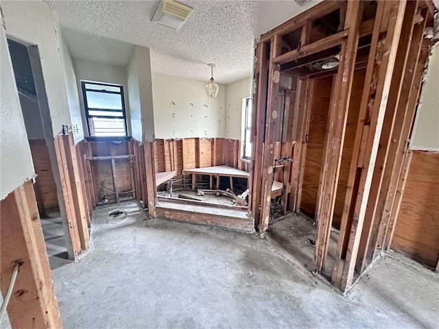 miscellaneous room featuring a textured ceiling