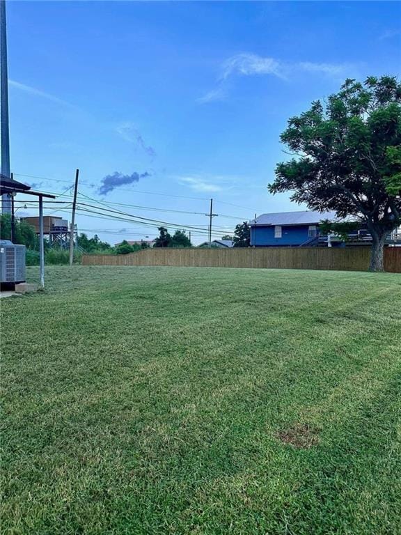 view of yard featuring central AC unit