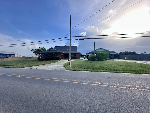 ranch-style home with a front lawn