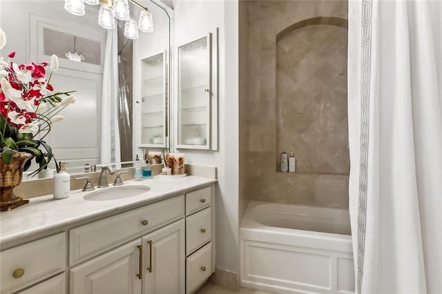 bathroom featuring vanity and shower / tub combo with curtain