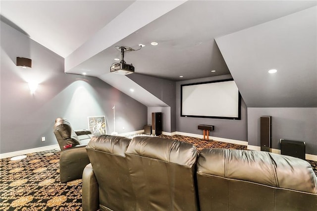 carpeted home theater room featuring lofted ceiling