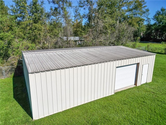 view of outbuilding featuring a yard