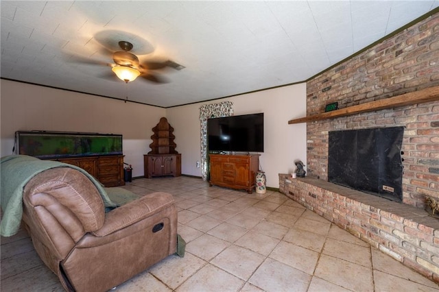 tiled living room with a brick fireplace and ceiling fan